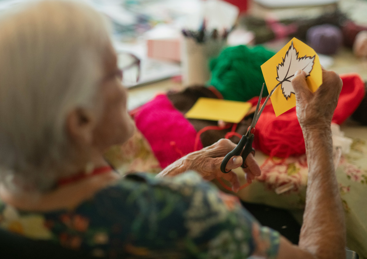 Resident painting at art class